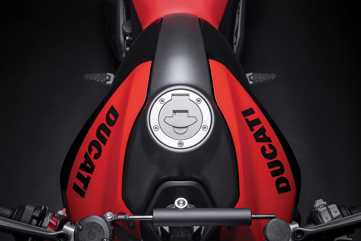 Closeup top view of red and black Ducati Monster bike